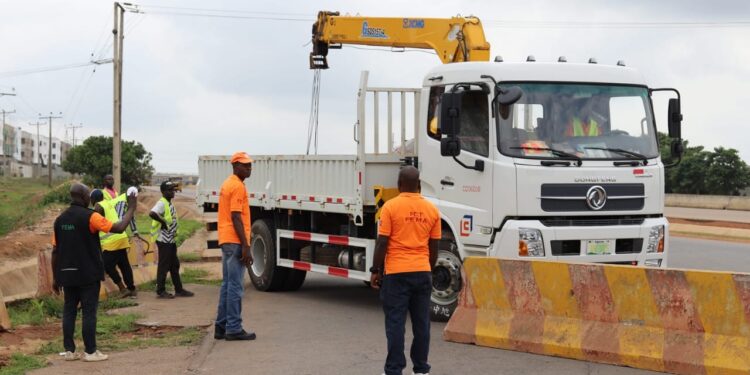 RAINY SEASON:  FEMD BARRICADES RING ROAD 2 INTERCHANGE, GALADIMAWA
